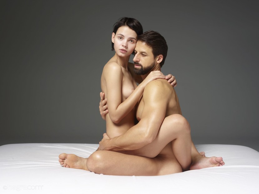 Man and woman naked in bed