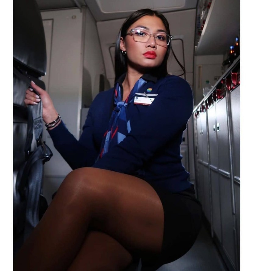 Ass, heels, legs in the tights of the stewardess