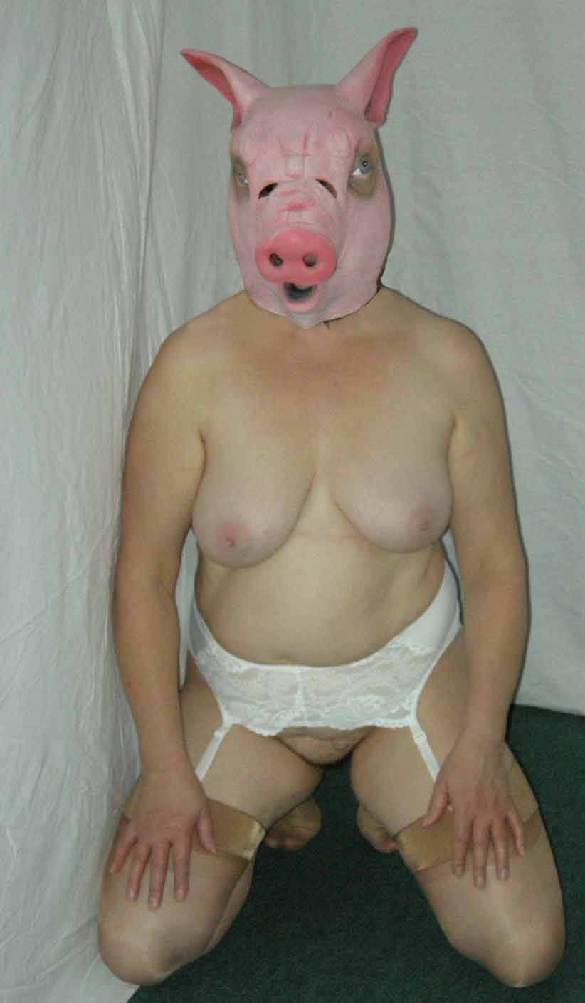 Naked woman in a costume of pigs