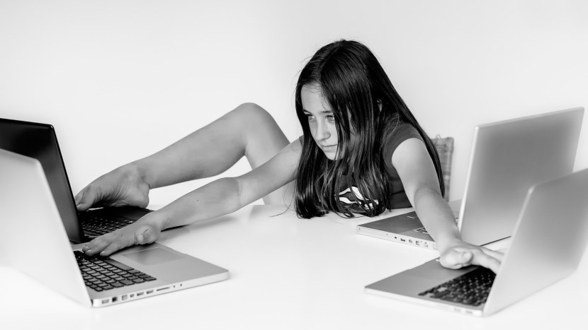 Girl sits at a computer