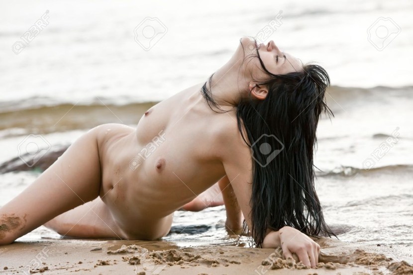Girls naked in the sand are small