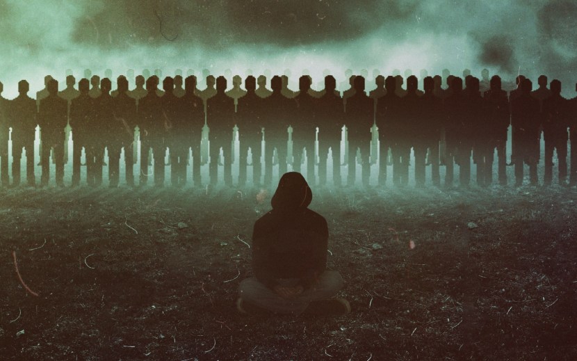 A crowd of people and one person
