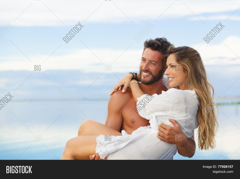 A man holds a blue guy in his arms