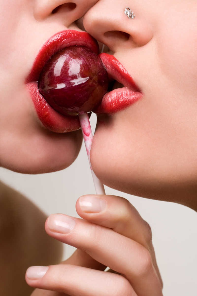 Girl sucking Chupa Chups