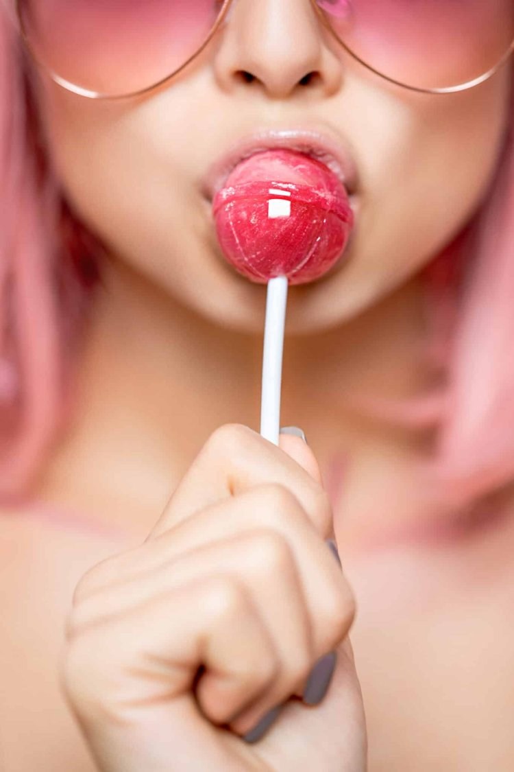 Chupa Chups behind the cheek