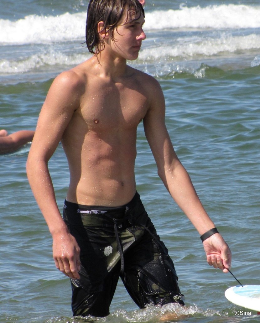 Guys in swimming trunks with large