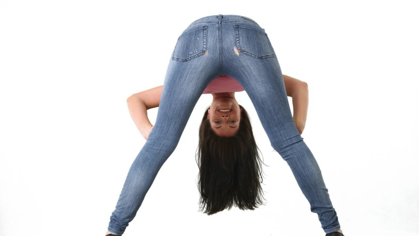 Girl in jeans with legs spread