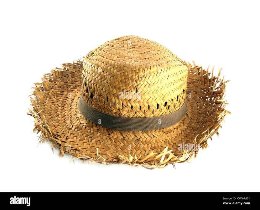 Girl in a cowboy hat by a haystack