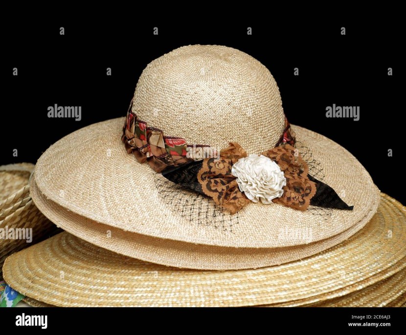 A man sits on a haystack