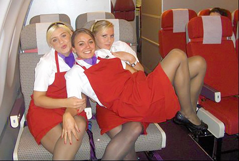 Under a skirt on an airplane