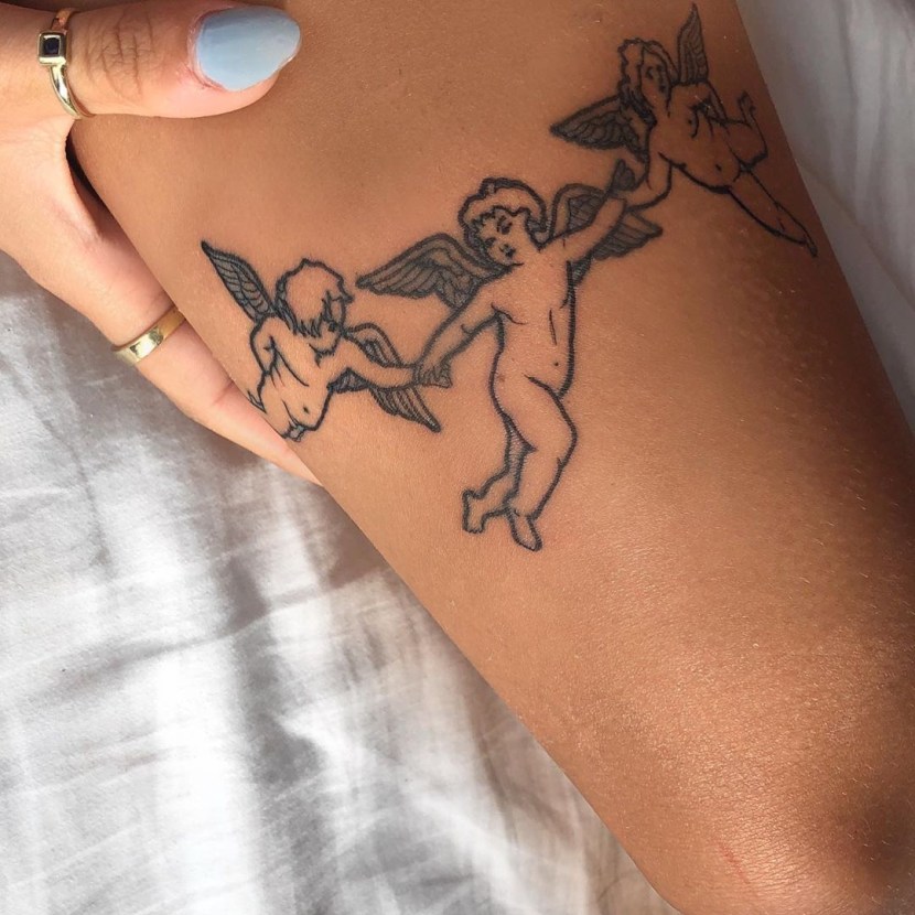 Tattoo Cupid on the arm