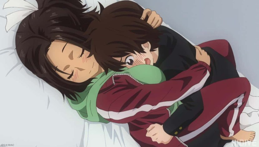 The teacher points to the board