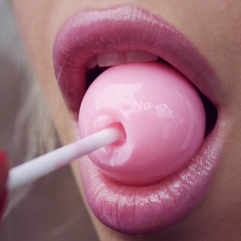 He licks Chupa Chups