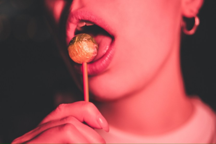 Girl licks Chupa Chups