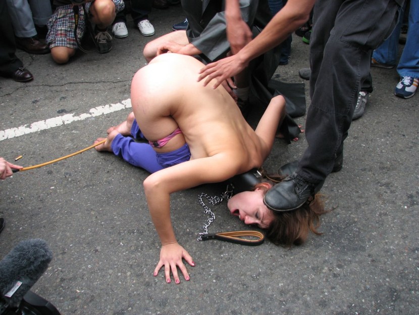 Naked women beat a woman