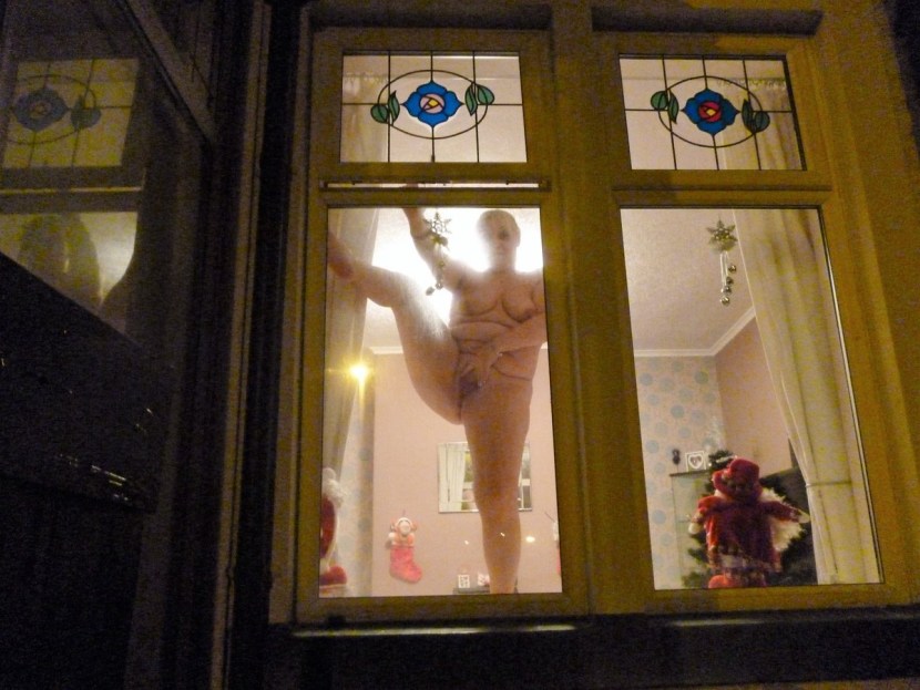 Naked in the windows of neighboring houses