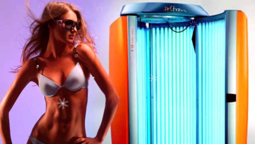 Girl in vertical solarium