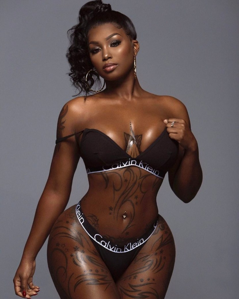 Naked tattooed mulatto