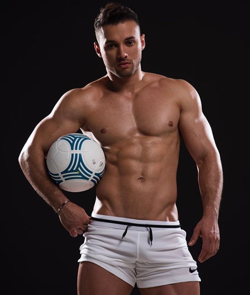 Fitness man on a yellow background