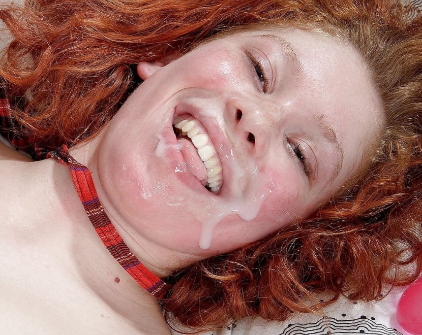 A red -haired girl sucks