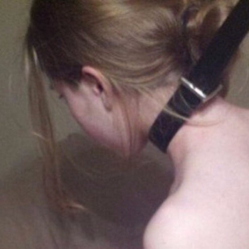 Naked petgirl in a muzzle