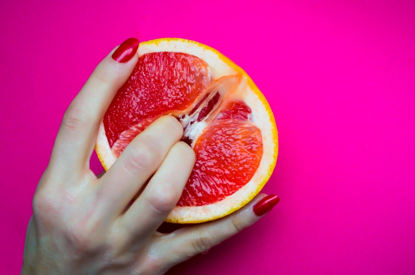 Fingers in grapefruit