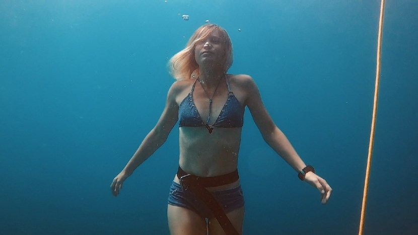 Girl in a dress on snowboarding