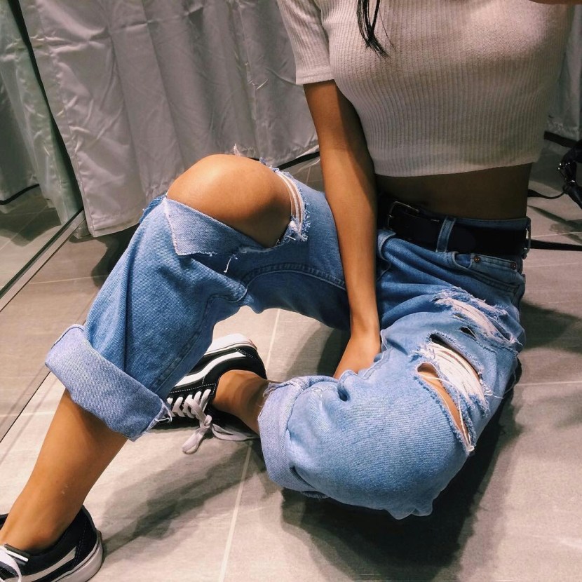 Girl in jeans without face