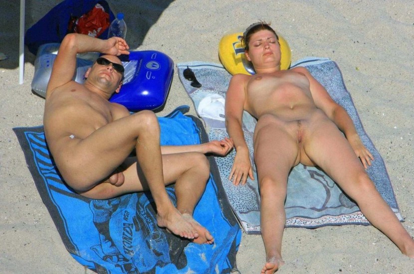 Naked men and women on the beach