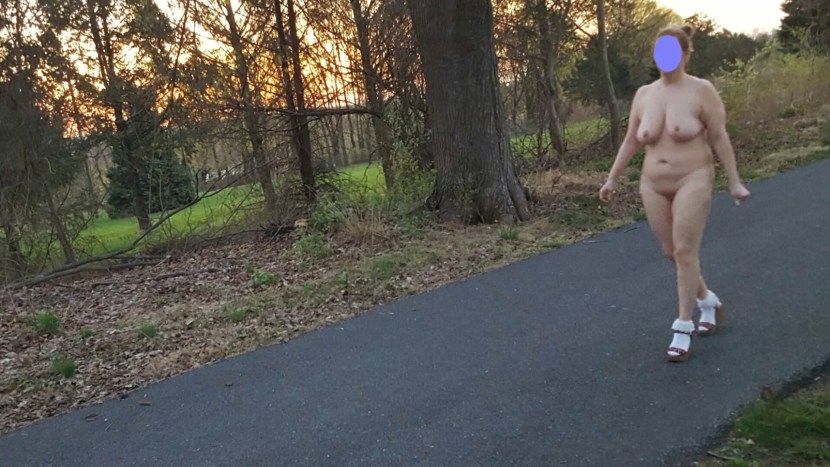 Woman undresses in public