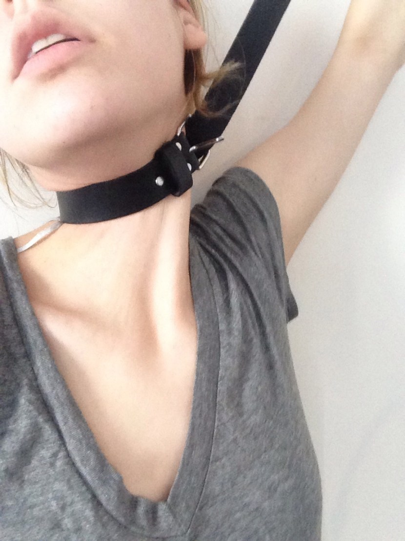 Girl with a belt on her neck