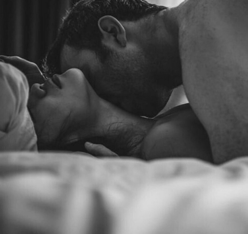 Passionate kiss in bed