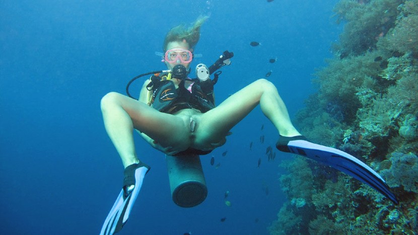 Naked women with flippers underwater
