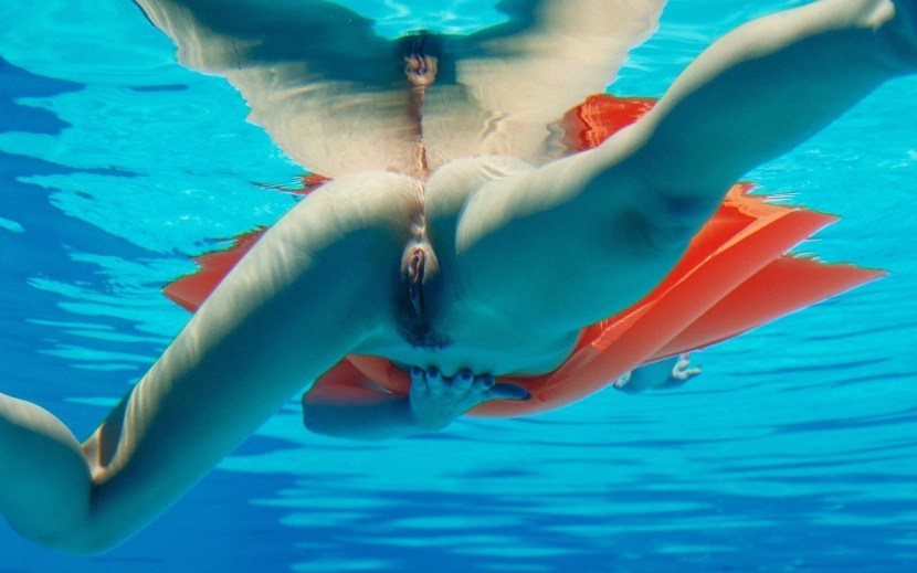 Naked divers underwater