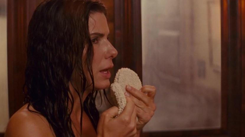 Sandra Bullock comes out of a naked bath