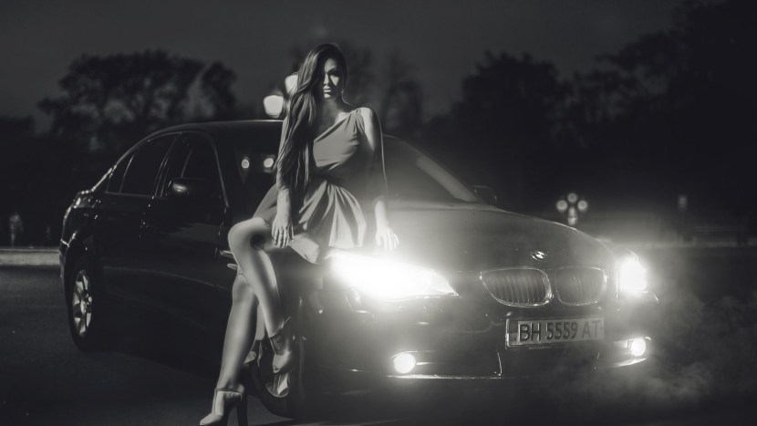 Girl near the car at night