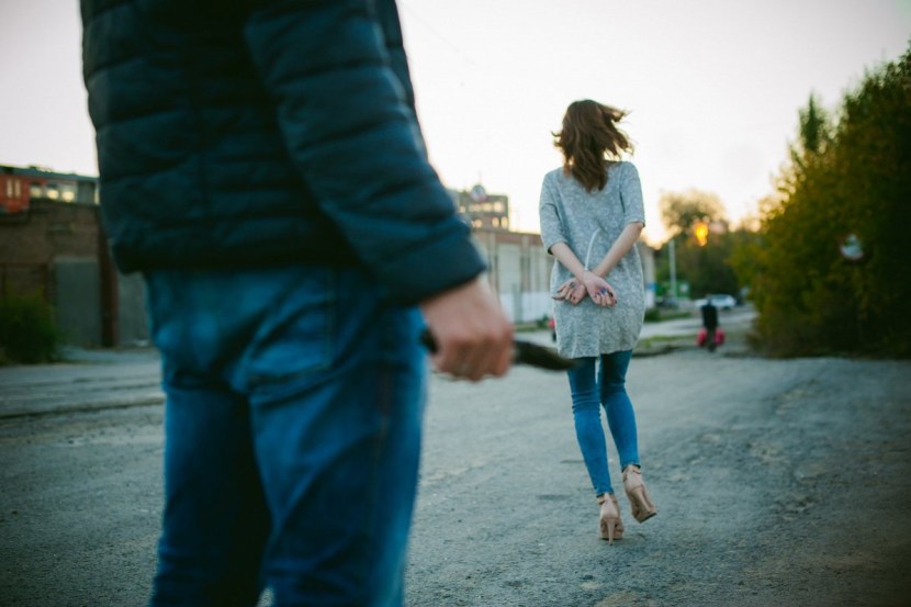 A man with a gun in the mouth