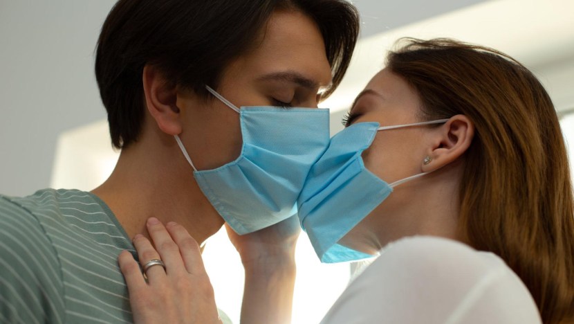 Woman in A Gas Mask and Gloves Jerks Off A Cock and Sucks