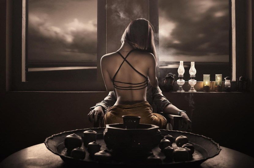 Woman on the table in front of a man