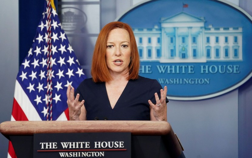 Psaki in pink earflaps photo