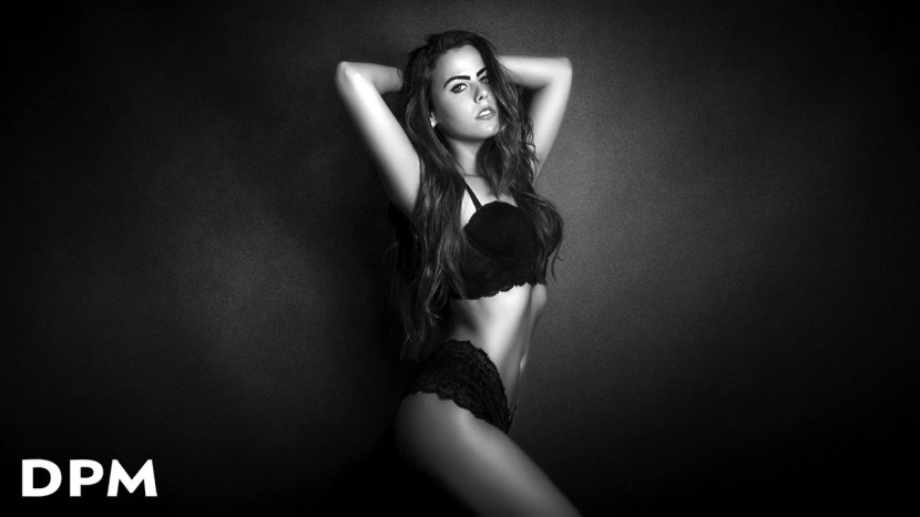 Girl in linen on a dark background