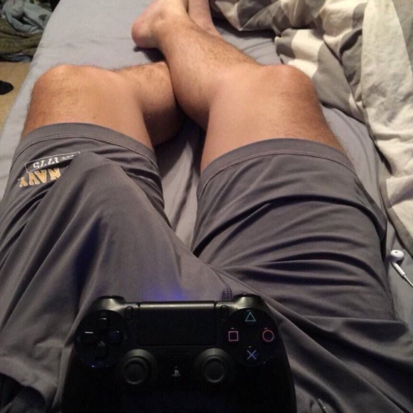 Men's legs on the bed