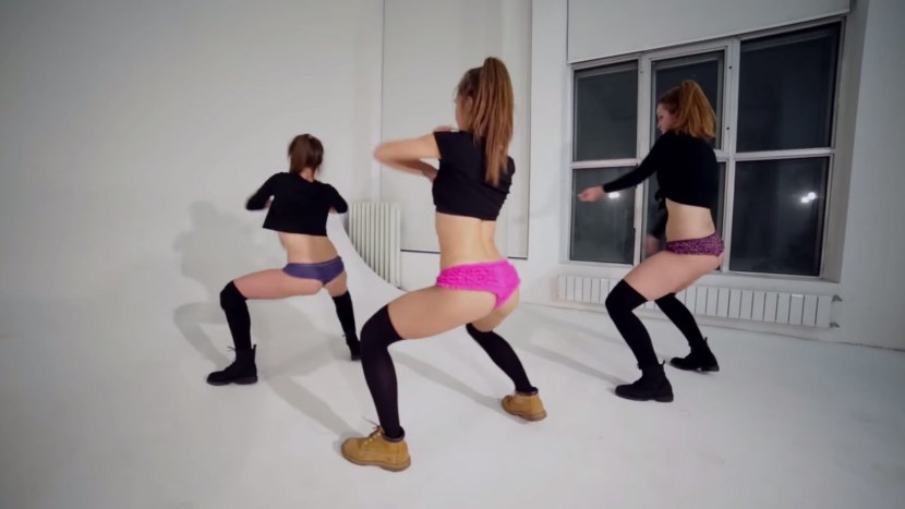 Girls in a red swimsuit with a cocktail