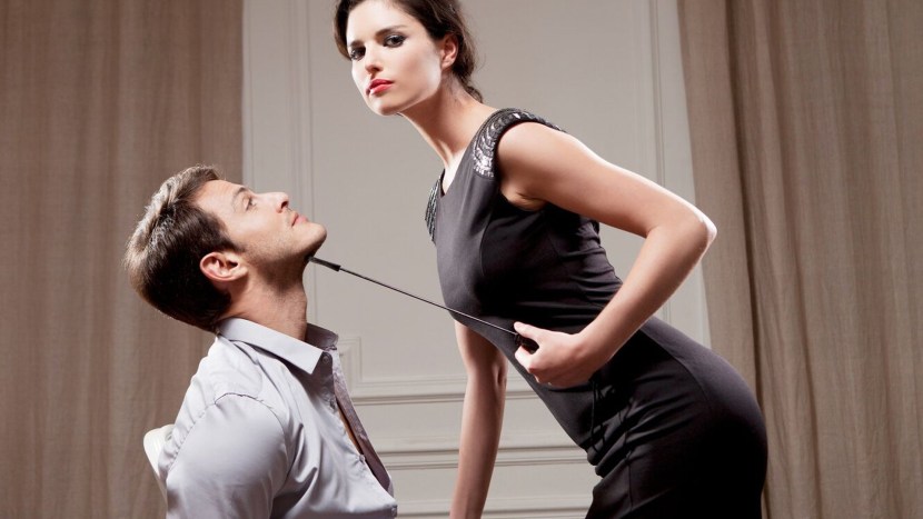 A tied man and domina woman