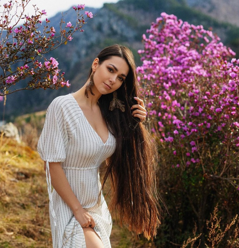 Helga Lovekaty in a green swimsuit