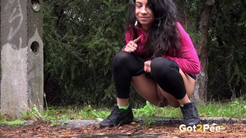 Female pissing in nature