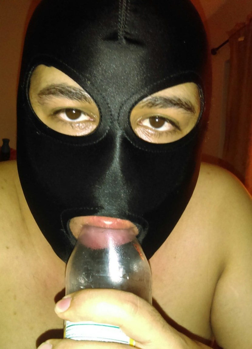 In latex and mask BDSM guy