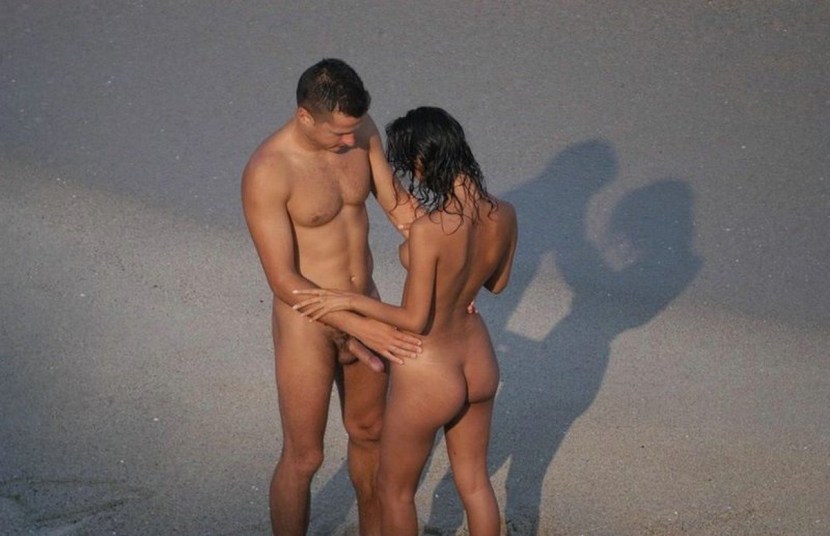 Naked men and women in nature