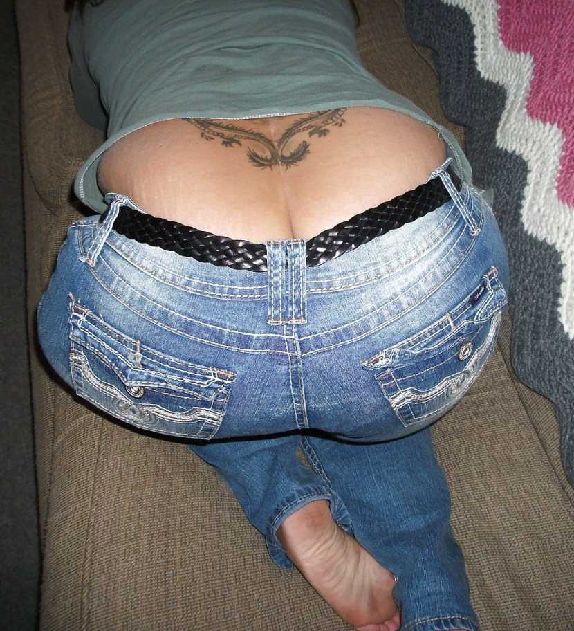 Naked butt in torn jeans