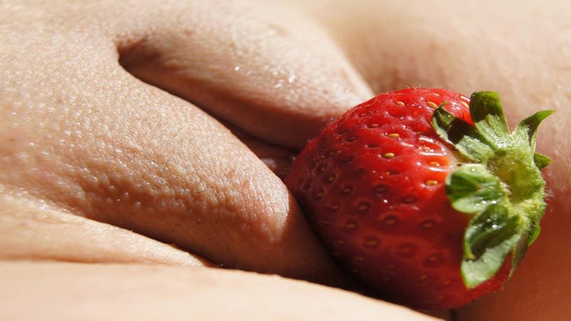 Put strawberries into the vagina
